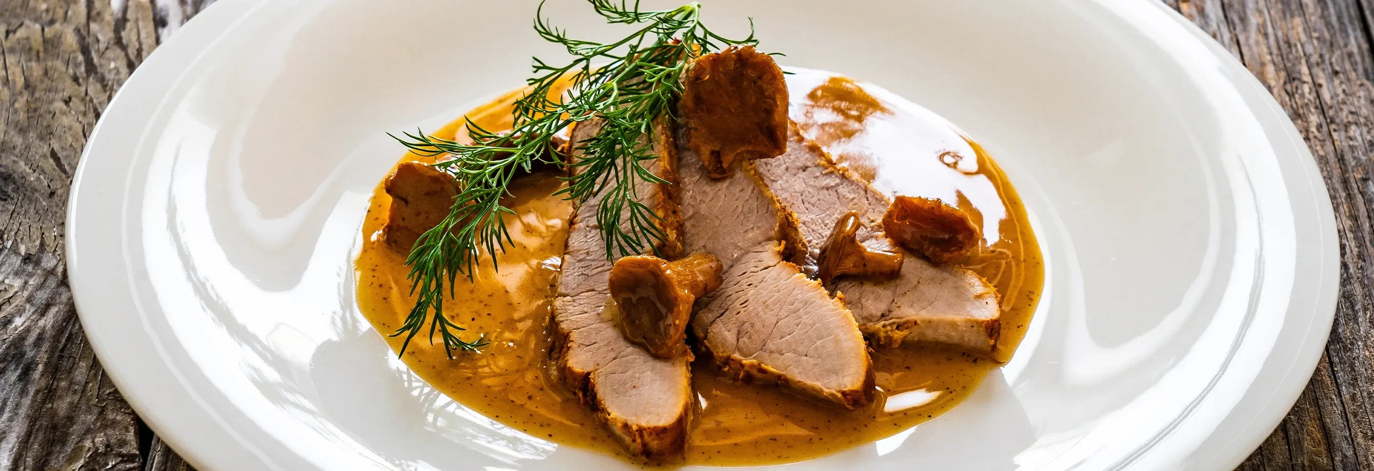 LOMO DE CERDO EN SALSA DE NARANJA